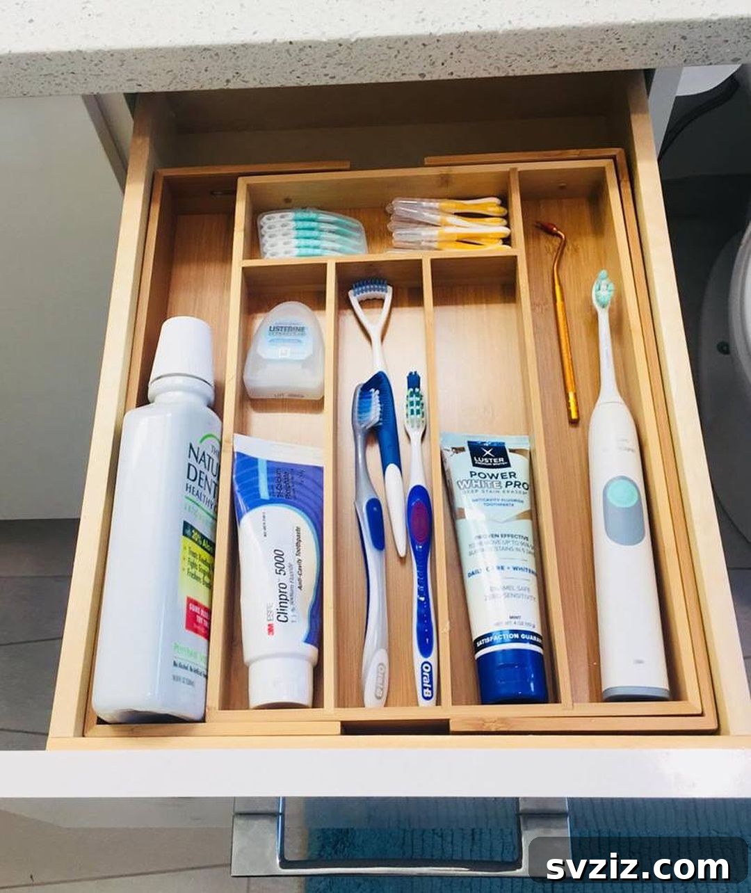 Beyond Cutlery: Smart Organization with Silverware Trays 4 Organized Bathroom Drawer with Repurposed Silverware Tray for Dental Care