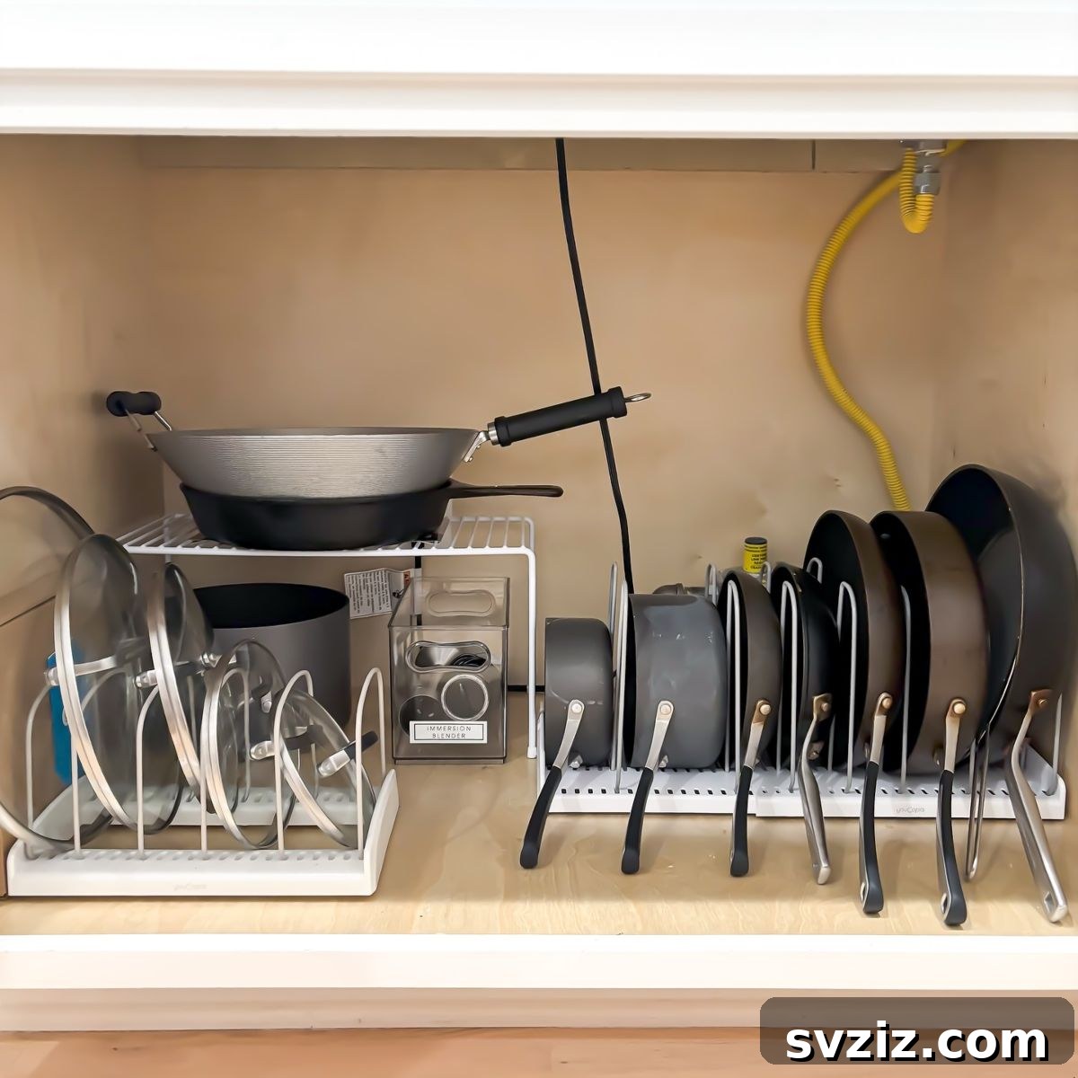 Vertical cookware rack organizing pots, pans, and lids