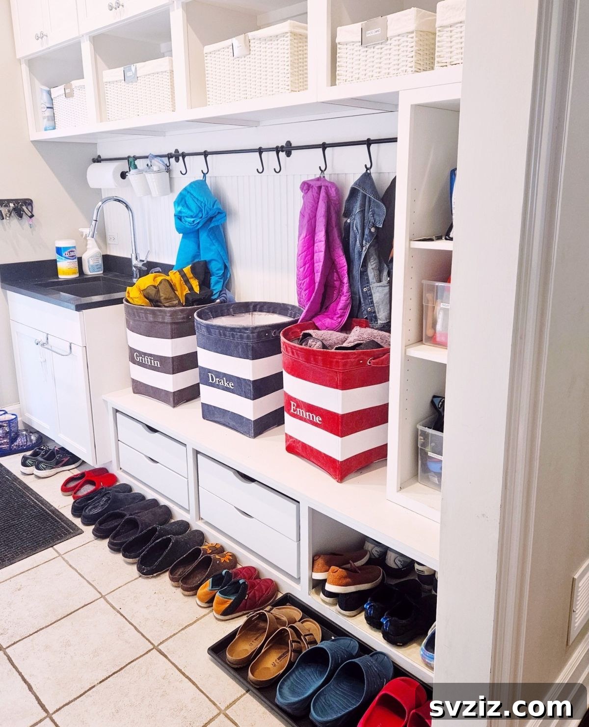 Mudroom with individual storage bins and hooks for each family member