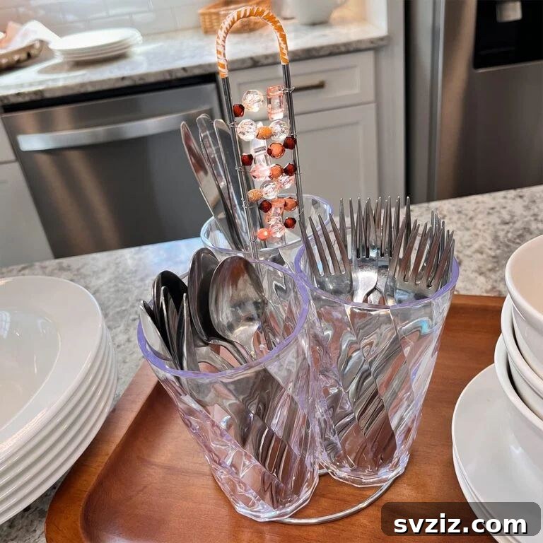 17 Smart Utensil Organizing Hacks 9 DIY silverware caddy crafted from an old paper towel holder and plastic cups, ideal for casual dining or picnics