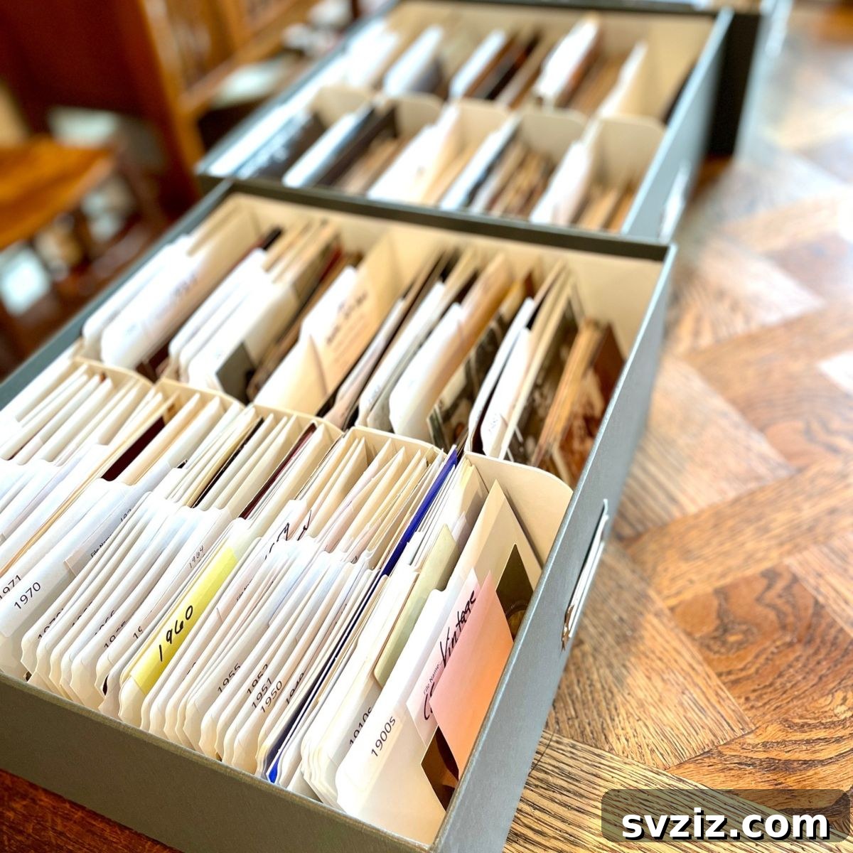 Organizing photos by year in labeled boxes