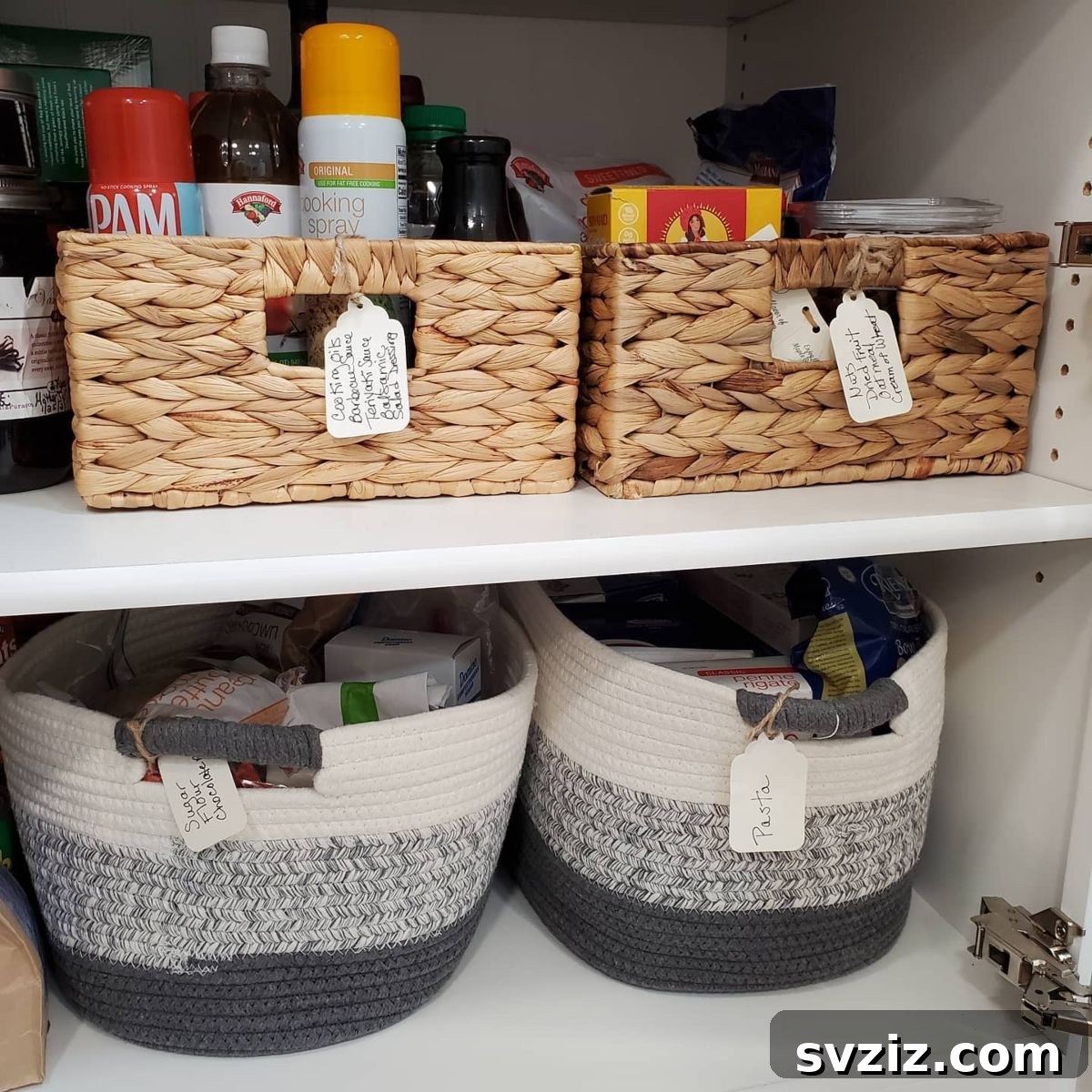 Stylish fabric storage bins arranged neatly in a modern pantry.