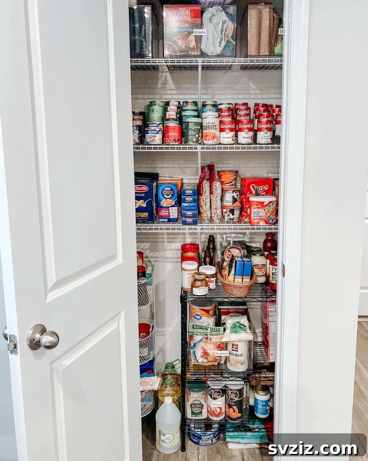 Multi-tiered vertical storage shelves maximizing space in a compact pantry.