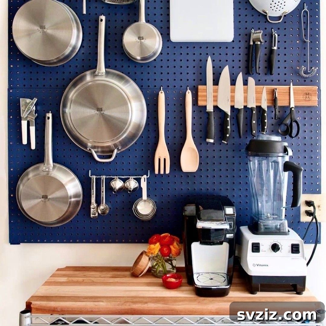 21 Clever Pegboard Organization Ideas 11 Kitchen Utensil Space organized on a pegboard for easy access