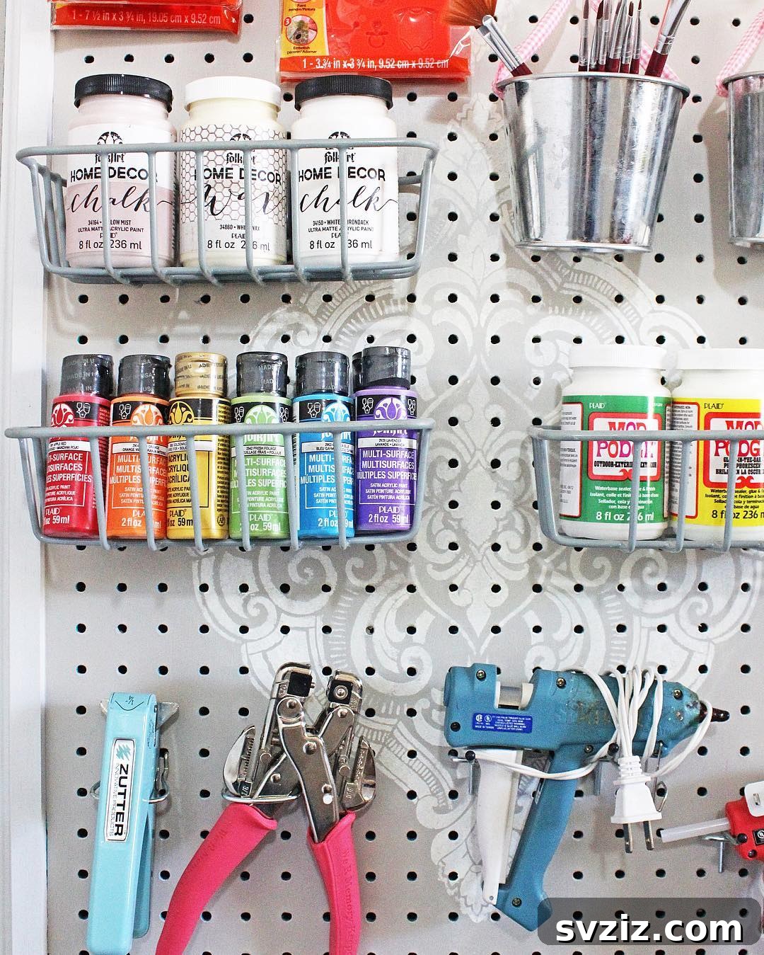21 Clever Pegboard Organization Ideas 16 Pegboard Craft Organizer for paints and art tools