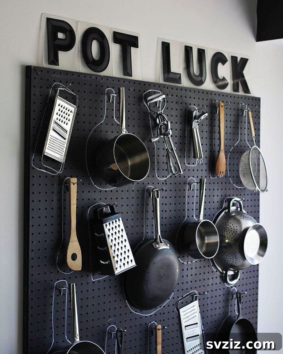 21 Clever Pegboard Organization Ideas 6 Kitchen Pot Storage on a pegboard to save cabinet space