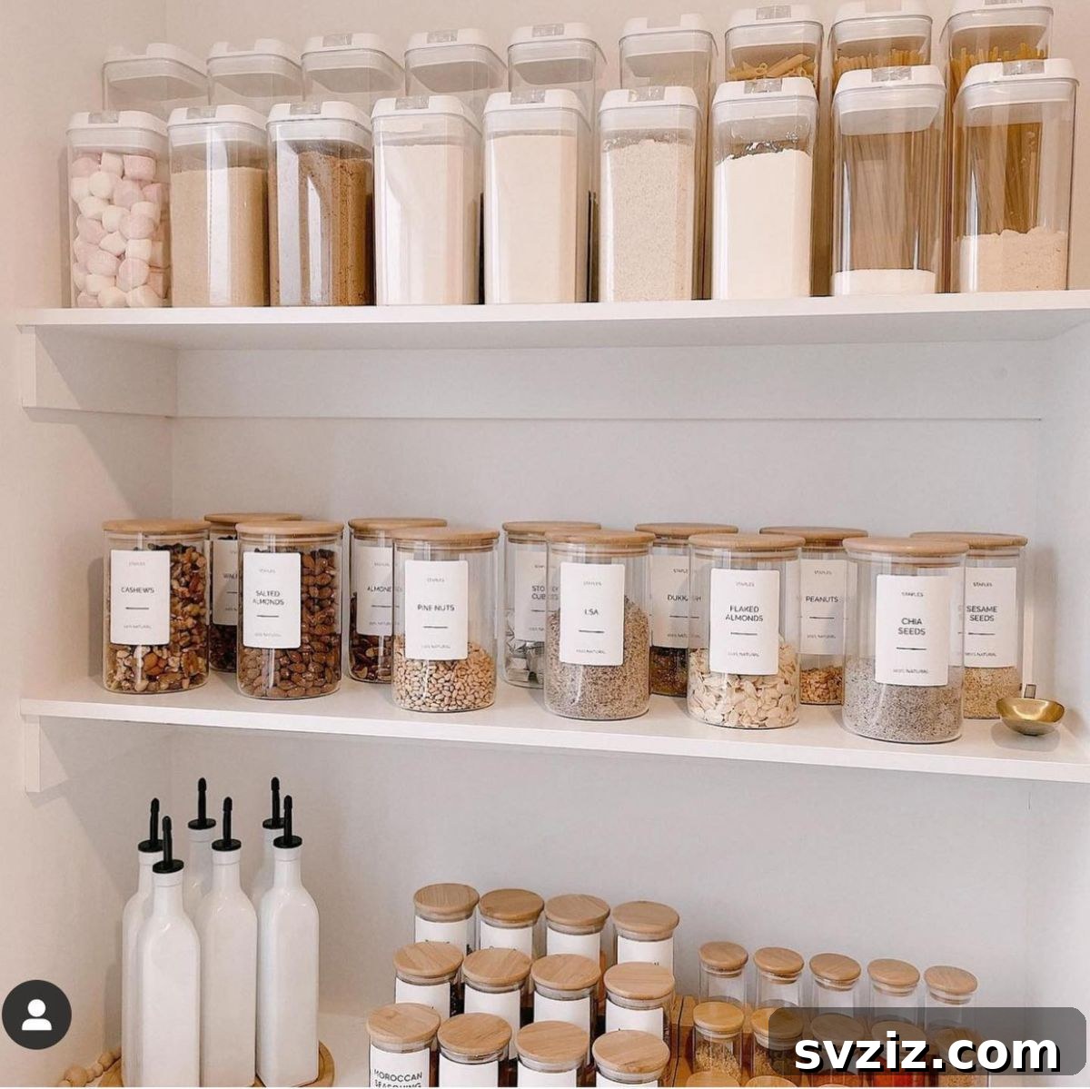 27 Chic & Stylish Home Organization Hacks for a Beautifully Transformed Space 14 Kitchen pantry organized with elegant dry goods containers