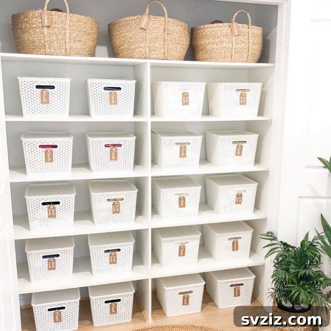 27 Chic & Stylish Home Organization Hacks for a Beautifully Transformed Space 16 Linen cupboard organized with matching white labeled baskets