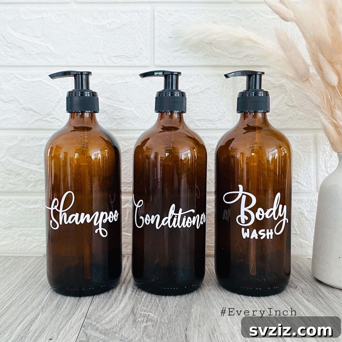27 Chic & Stylish Home Organization Hacks for a Beautifully Transformed Space 22 Bathroom shower with amber brown glass dispenser bottles