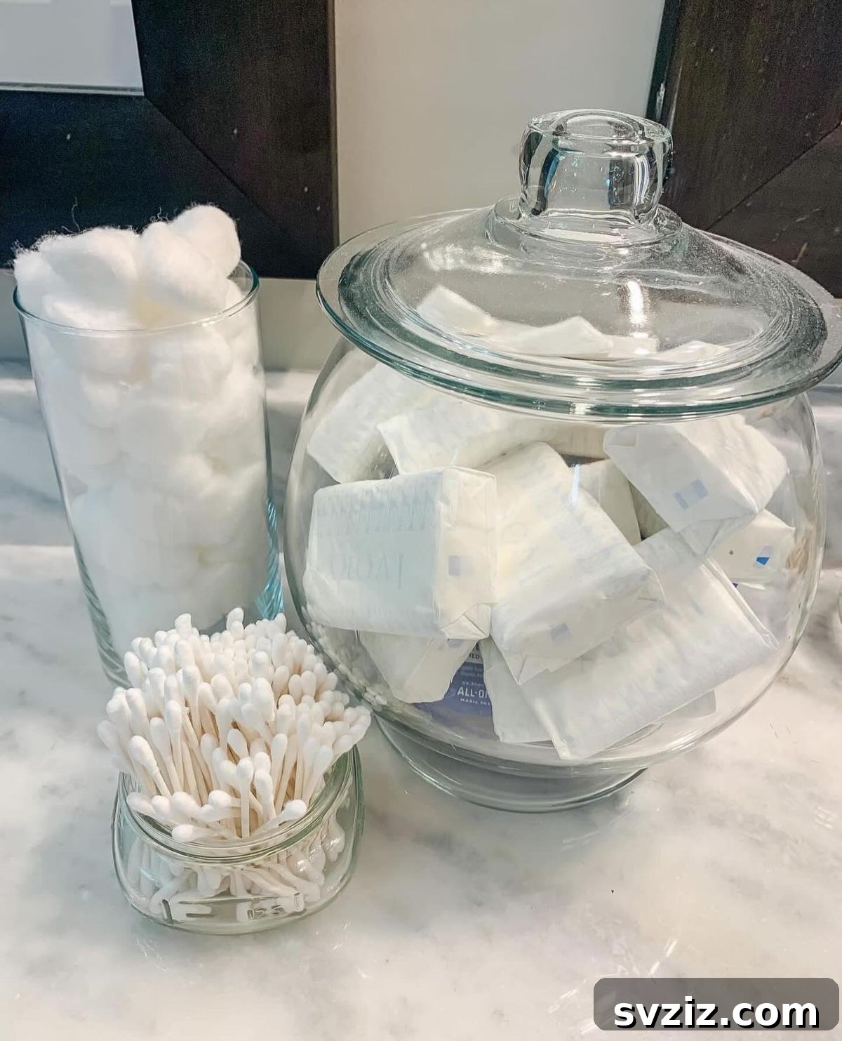 27 Chic & Stylish Home Organization Hacks for a Beautifully Transformed Space 10 Bathroom vanity organized with vintage style glass jars