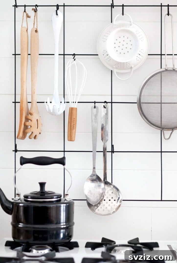 Sleek wire utensil rack in a modern kitchen