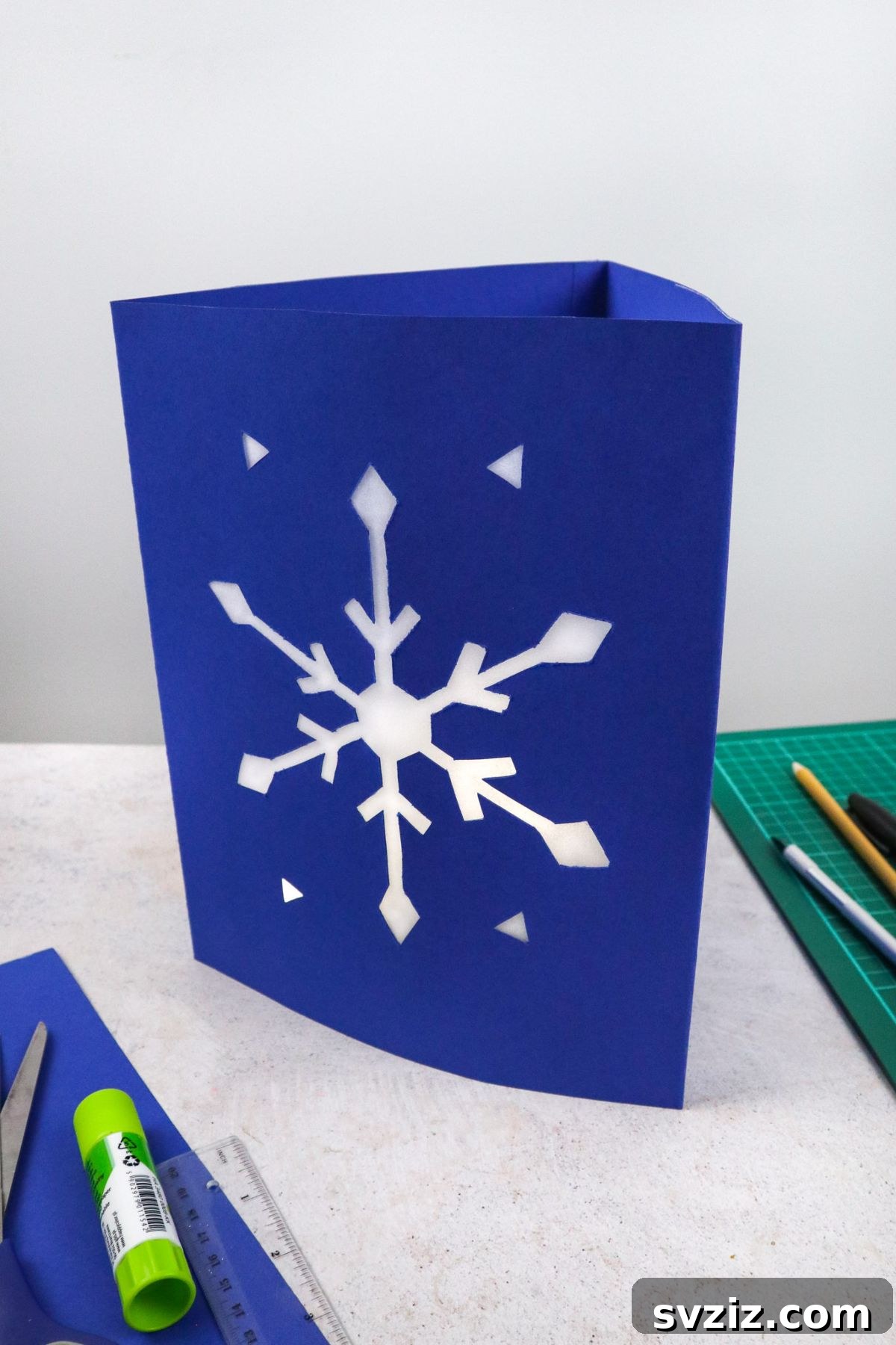 Sparkling Snowflake Luminaries 2 DIY Snowflake Lanterns, showcasing the finished craft in a winter setting.