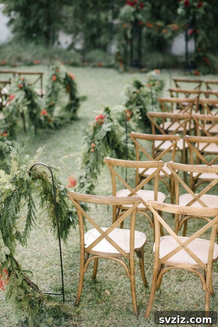 Host a Magical Backyard Wedding Without Breaking the Bank 21 Wedding aisle decorated with greenery garlands