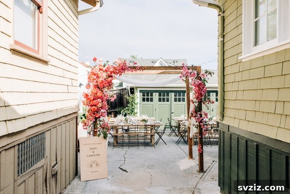 Host a Magical Backyard Wedding Without Breaking the Bank 10 Simple wooden arch decorated with floral garlands