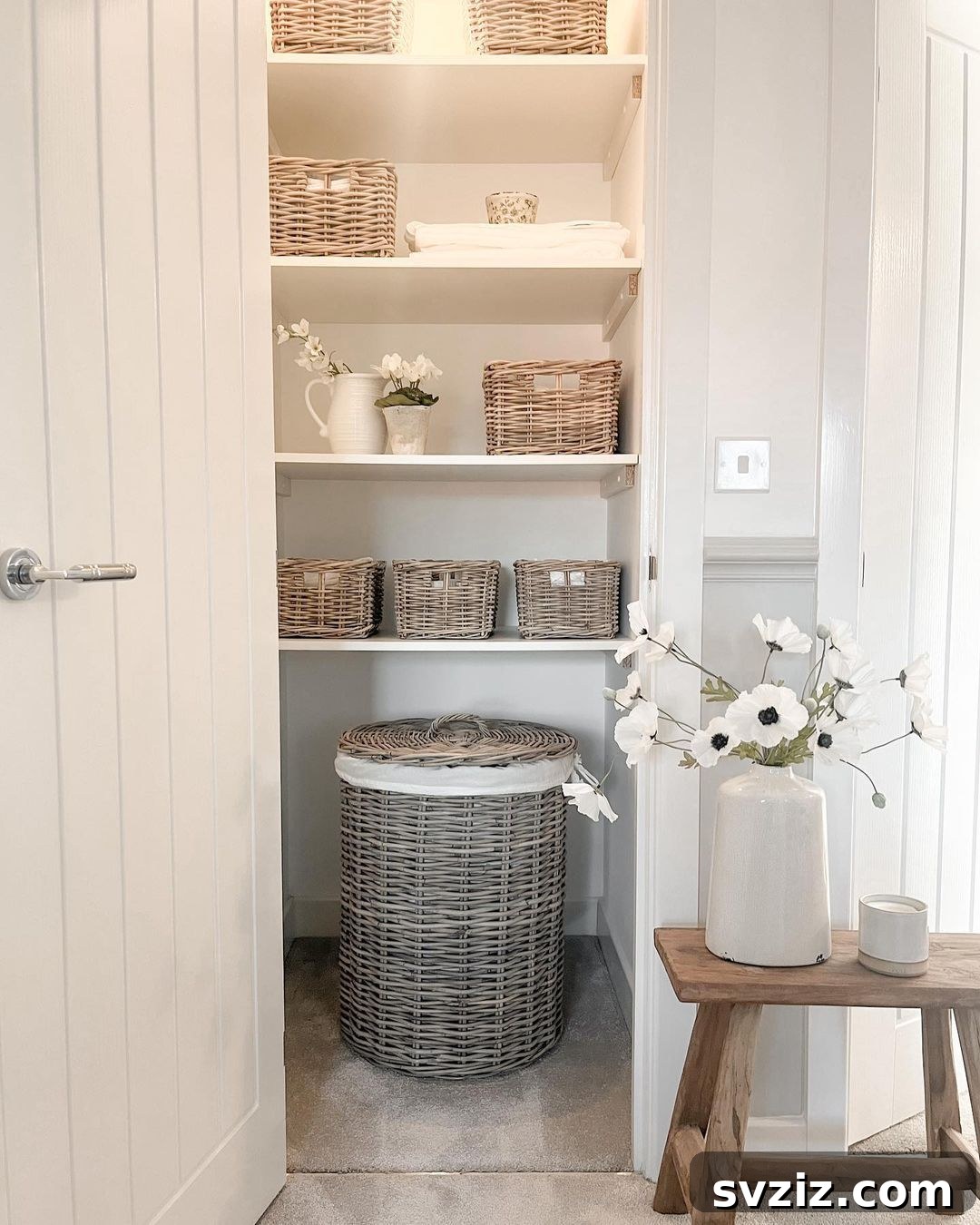 21 Genius Hacks to Master Your Coat Closet Organization 13 Wicker baskets used for storage in a coat closet, adding a rustic touch.
