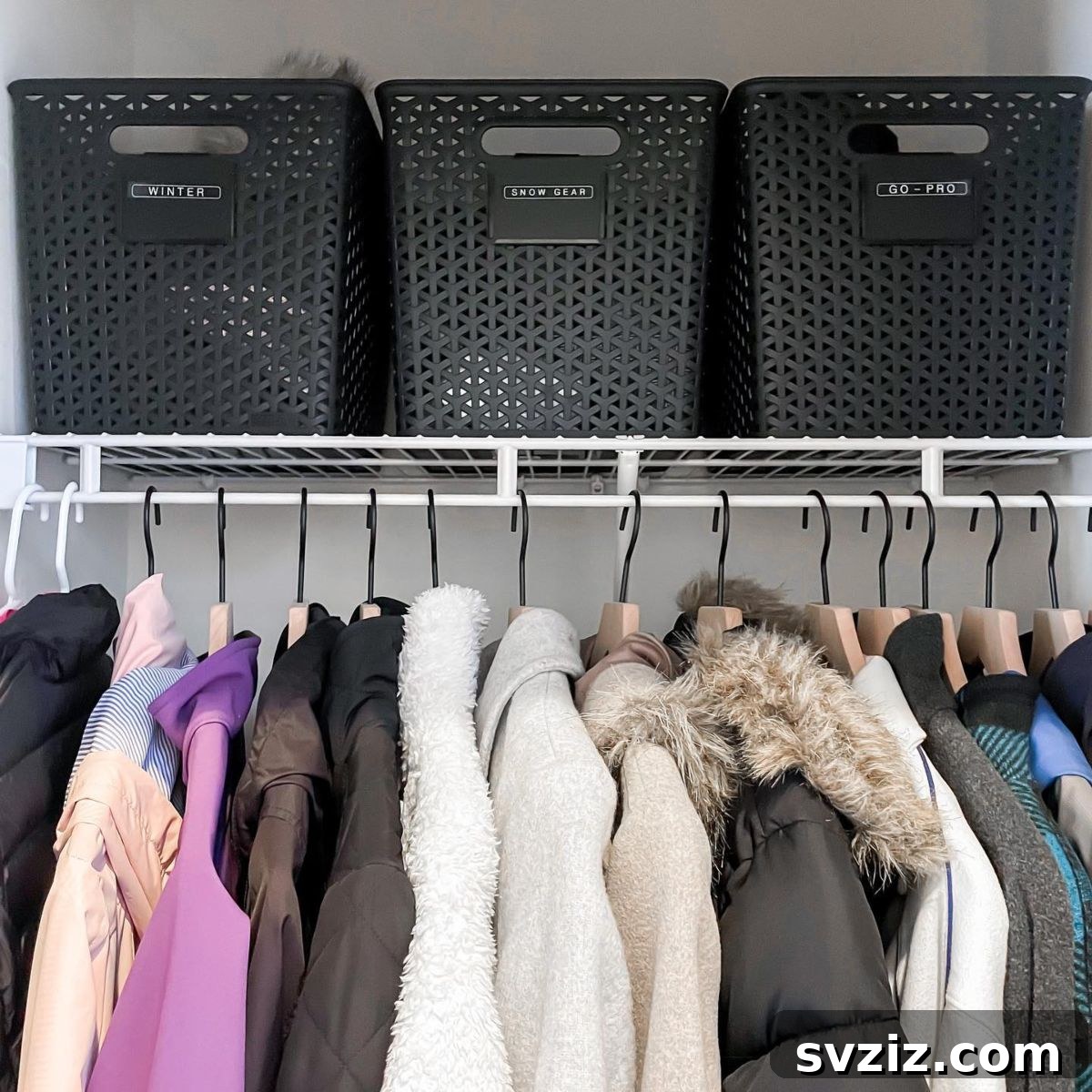 21 Genius Hacks to Master Your Coat Closet Organization 20 Neatly labeled storage bins in a coat closet for easy identification.