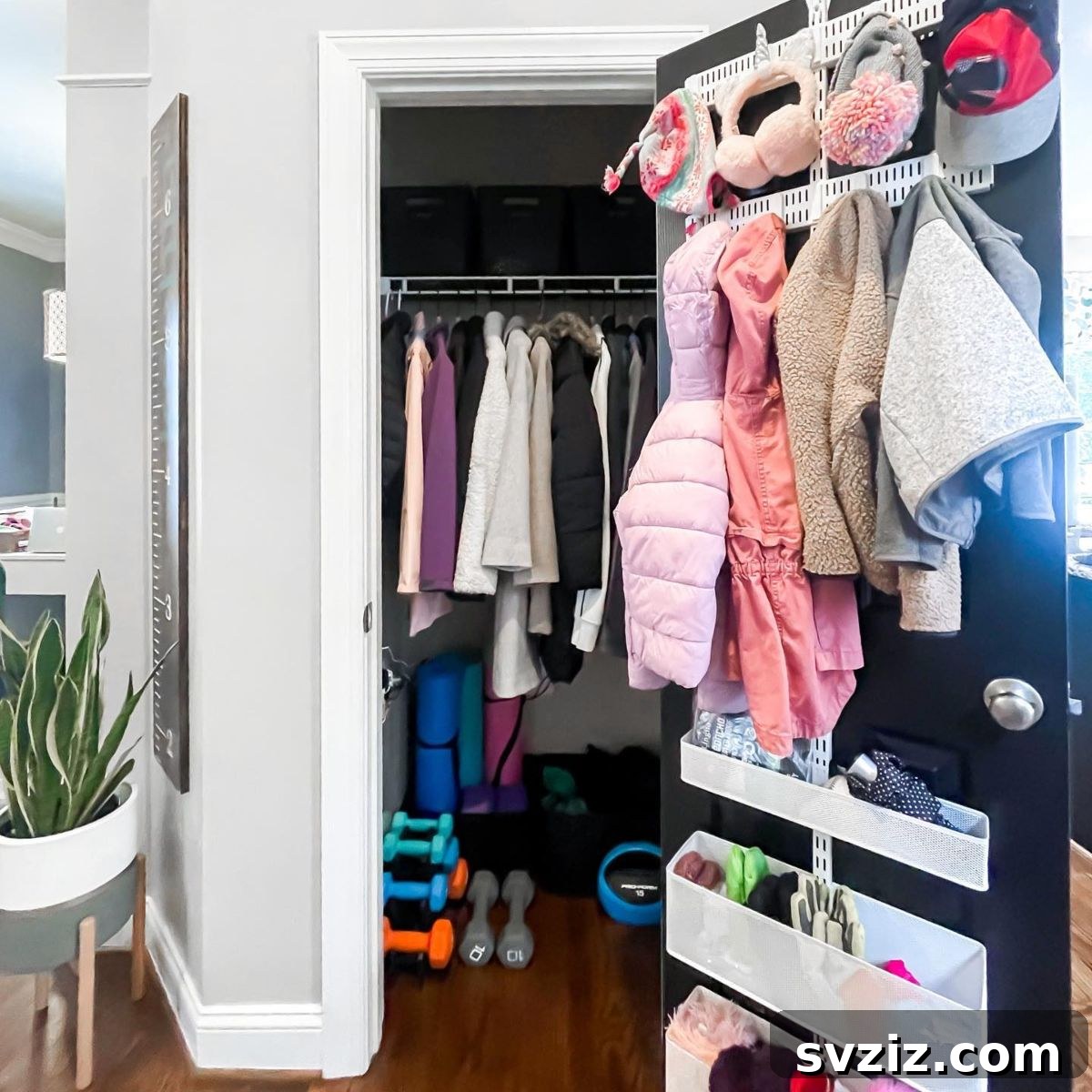 21 Genius Hacks to Master Your Coat Closet Organization 7 Over-the-door hat and accessory holder in a coat closet.
