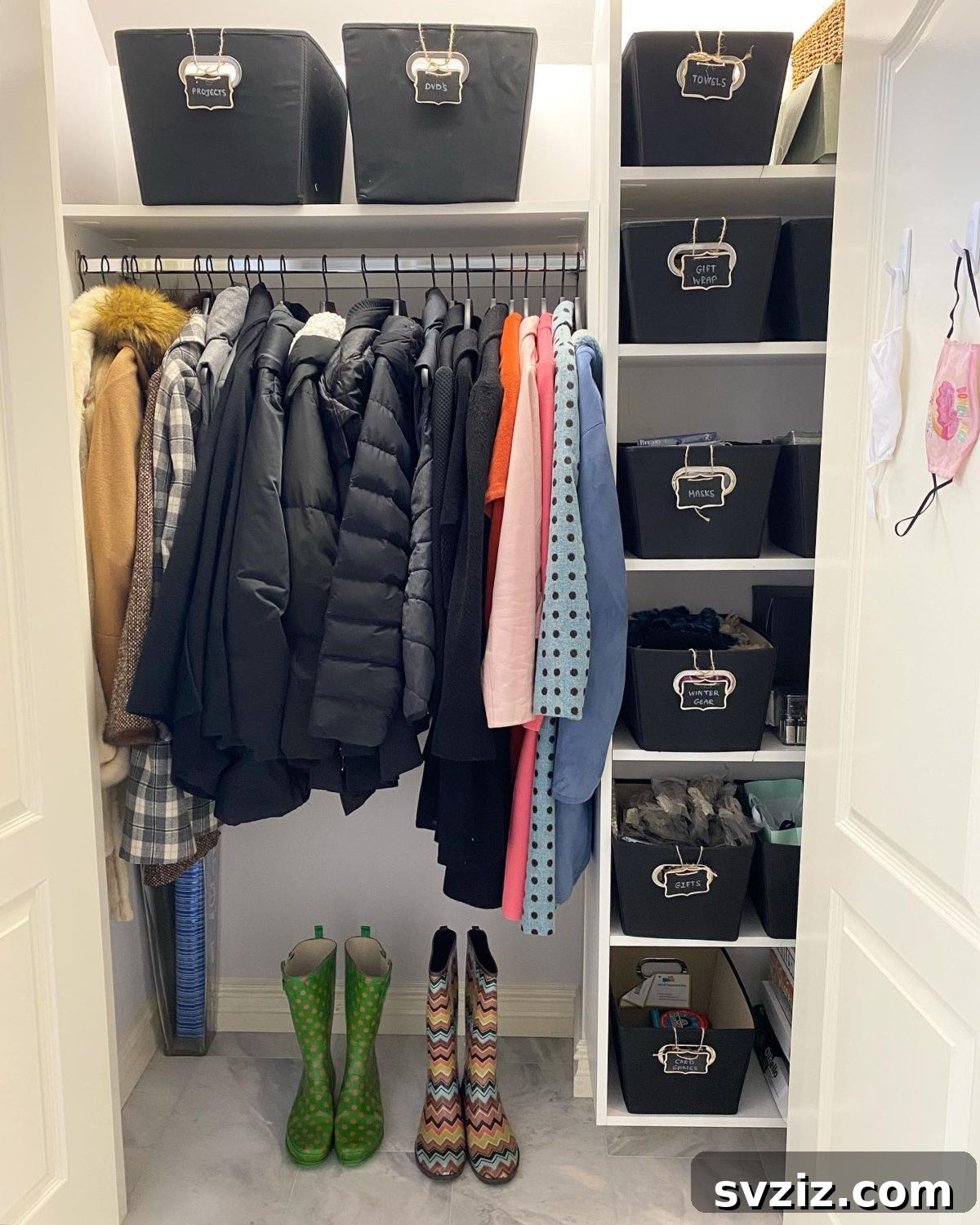 21 Genius Hacks to Master Your Coat Closet Organization 8 Deep storage bins with labels in a coat closet.