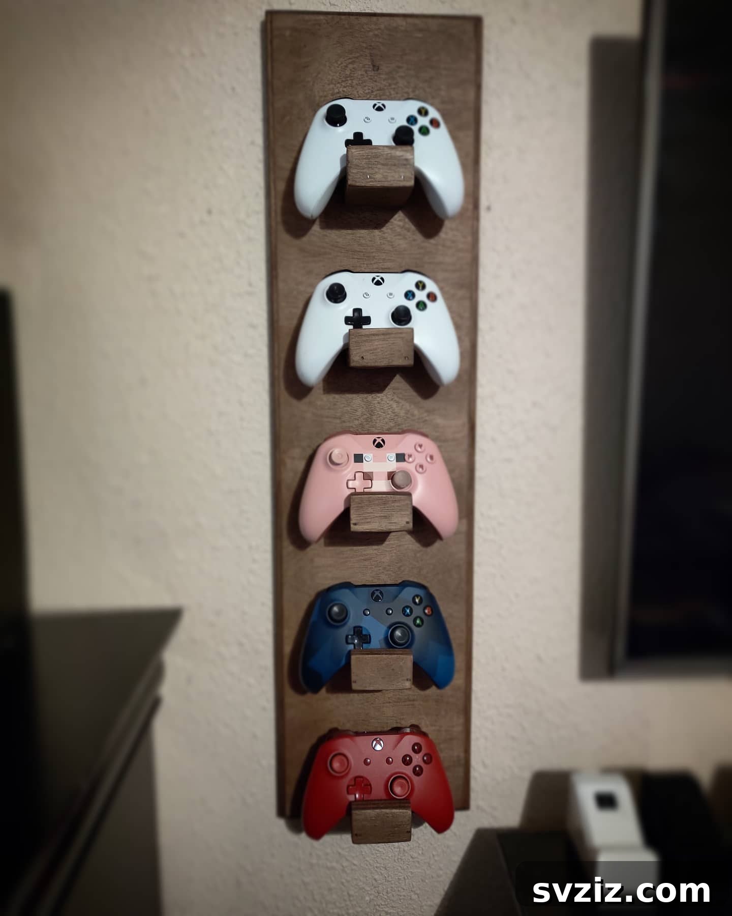 21 Genius Hacks to Organize Your Entertainment Hub 10 8. Controller Hanger