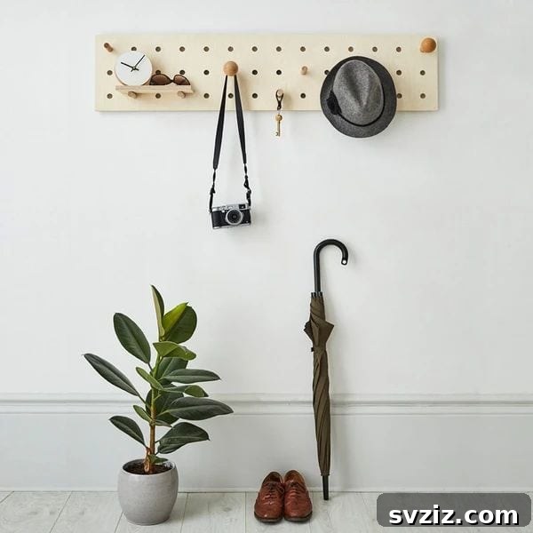 Pegboard in hallway for coats, keys, and bags