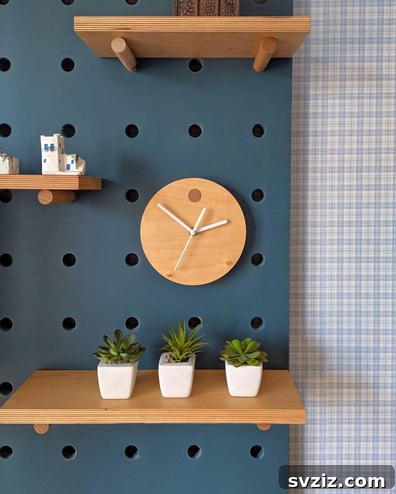 Pegboard with decorative floating shelves and clock