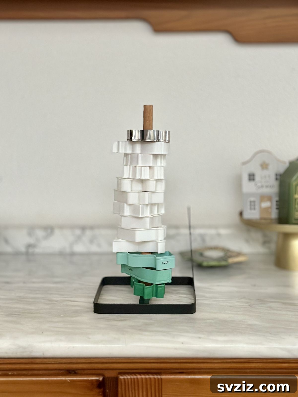 Paper towel holder used for cookie cutter storage