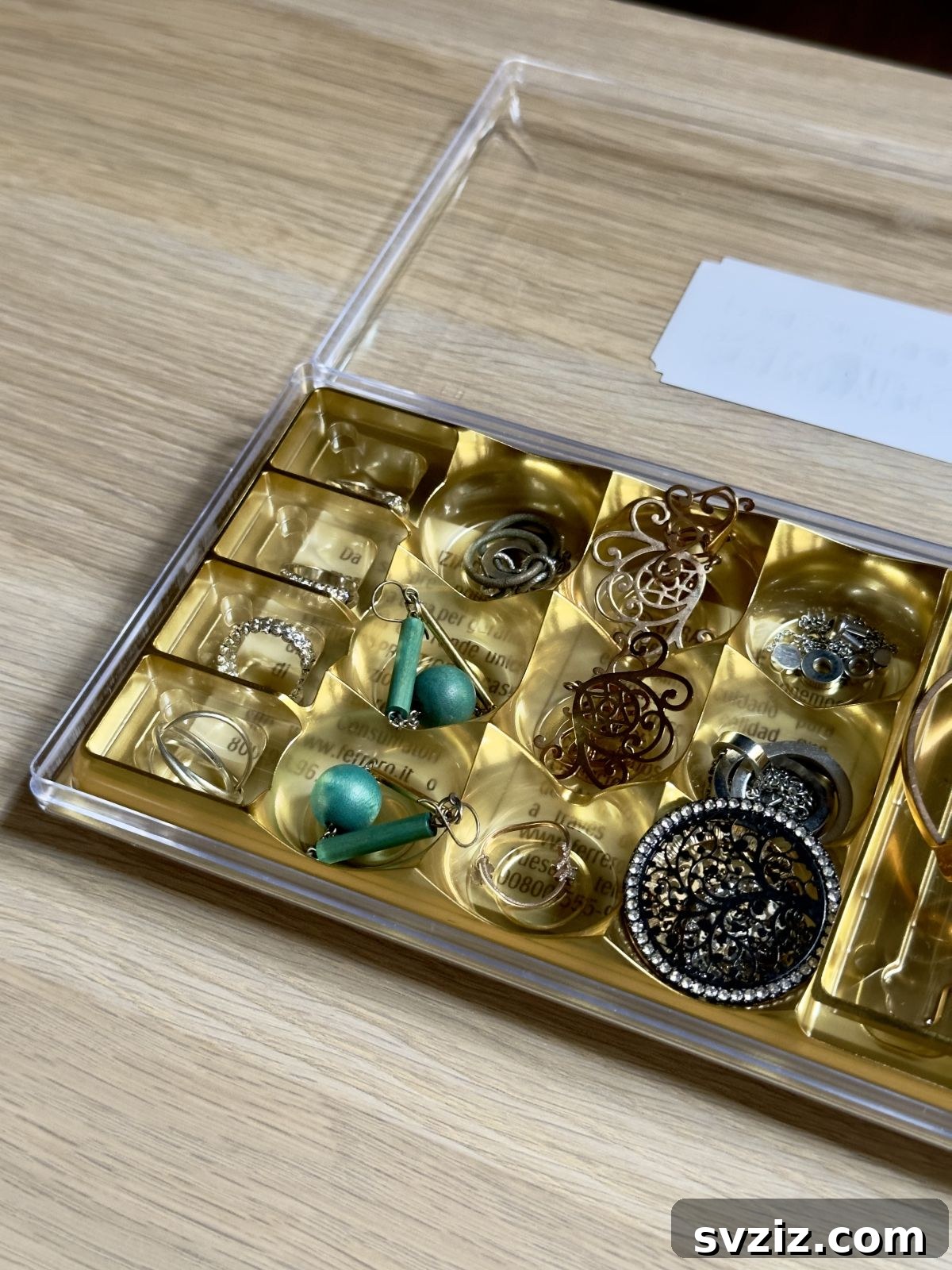 Chocolate tray repurposed as a jewelry organizer