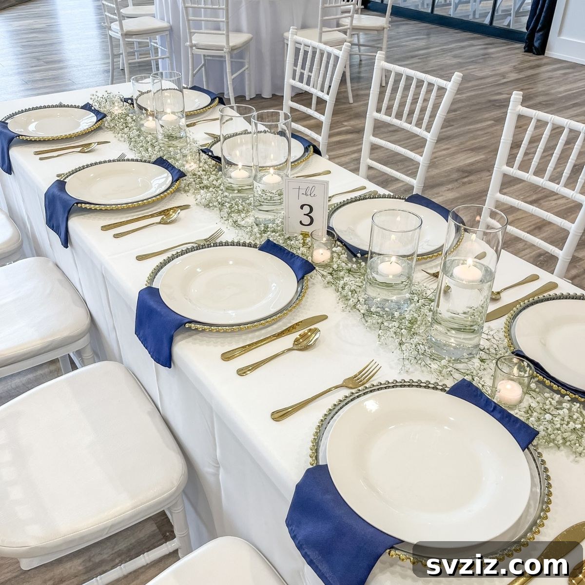 Charming baby's breath garland centerpiece extending the length of a wedding table, signifying purity and everlasting love.