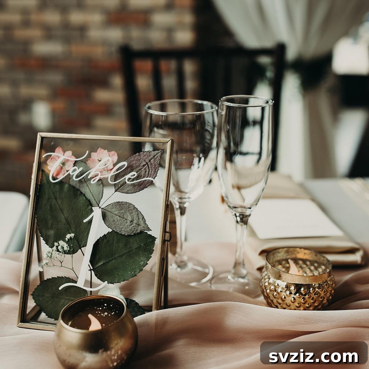 Unique nature-inspired floating table frames with pressed dried greenery, serving as elegant wedding place cards.