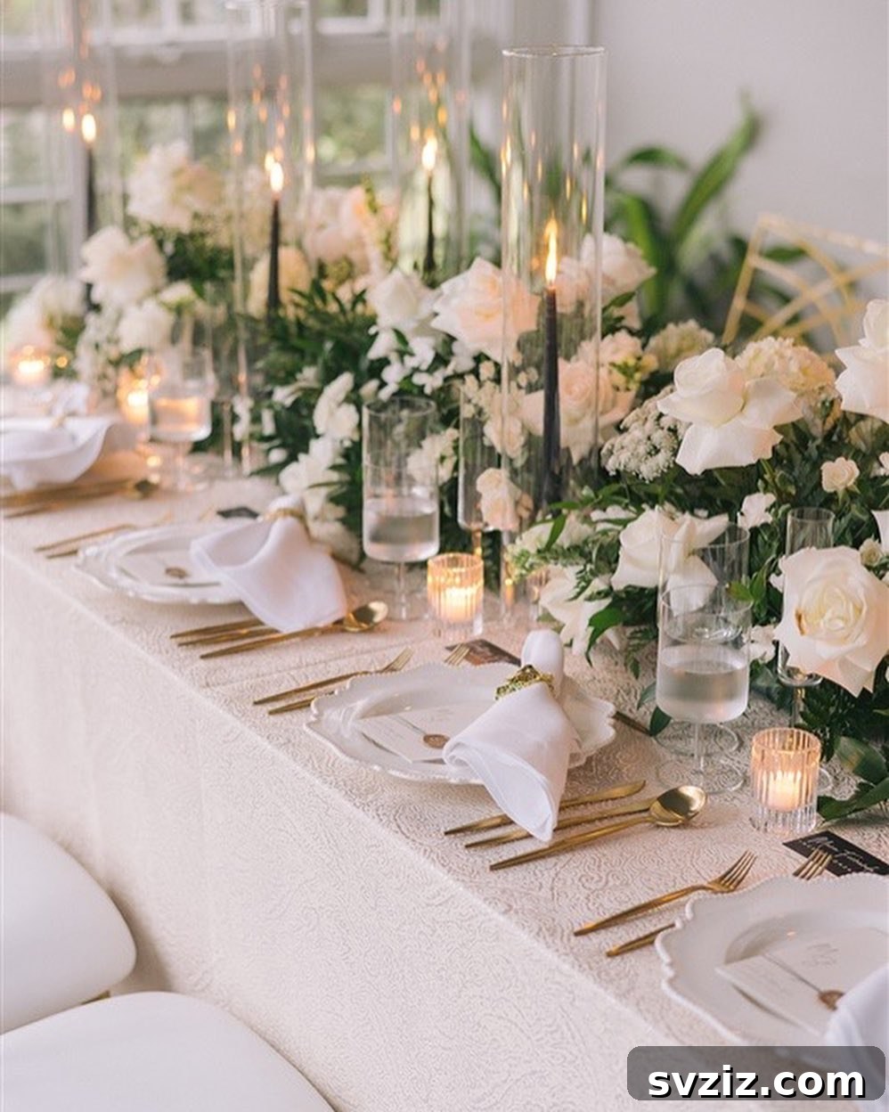 Opulent gilded herbal napkin rings adding a personal and luxurious touch to a classic wedding table setting.