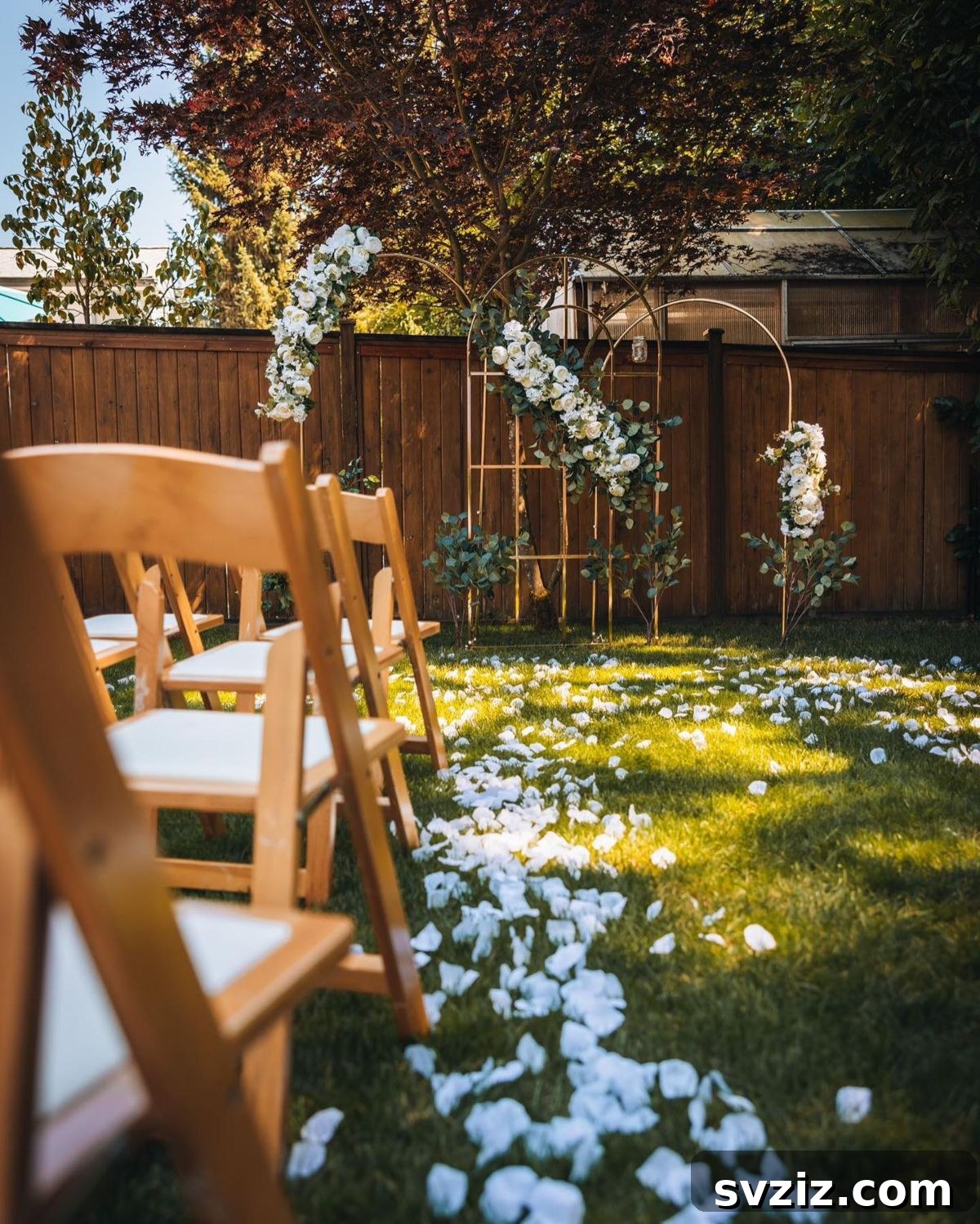 Enchanting Backyard Wedding Decor 13 11. Floral Ambiance and Golden Arches