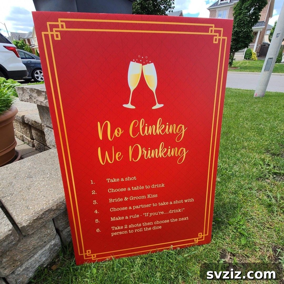 Wedding drinking game sign saying 'No Clinking, We're Drinking'