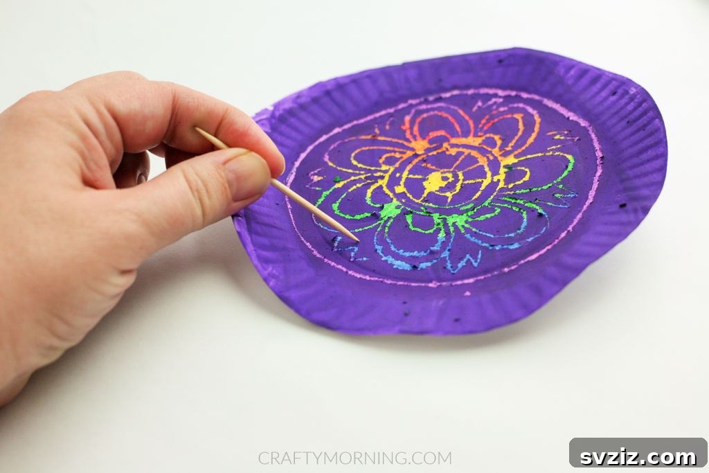 6. Scratch Art Using Paper Plates