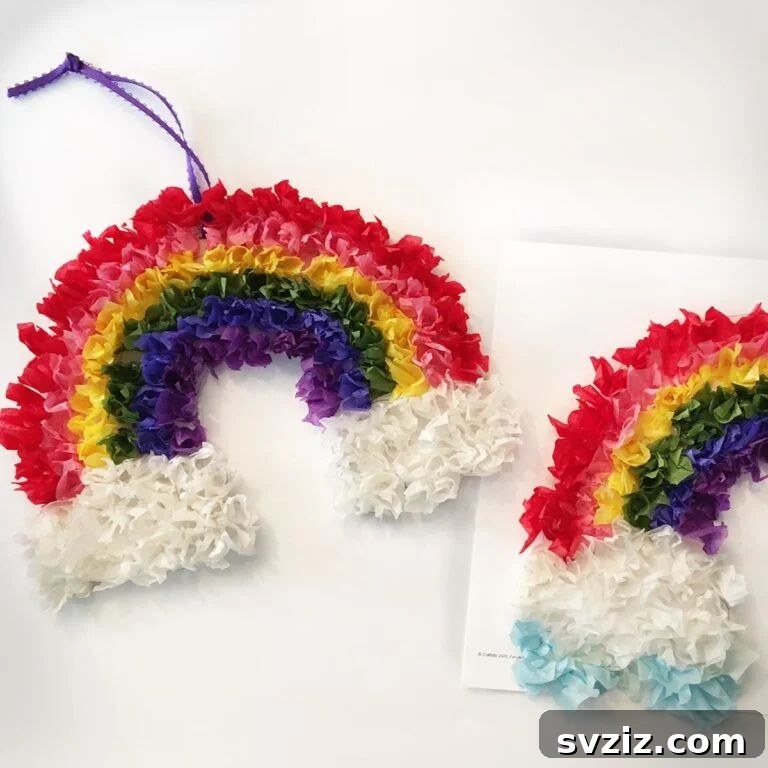 31 Effortless Kids Crafts for Hours of Fun 22 Vibrant Tissue Paper Rainbow Craft, a beautiful and colorful activity for kids using various shades of tissue paper.