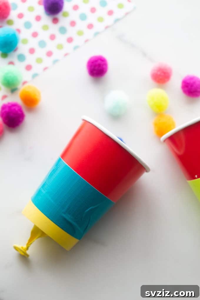 31 Effortless Kids Crafts for Hours of Fun 25 Exciting Pom Pom Shooter craft, offering customizable fun for kids to play with indoors or outdoors.