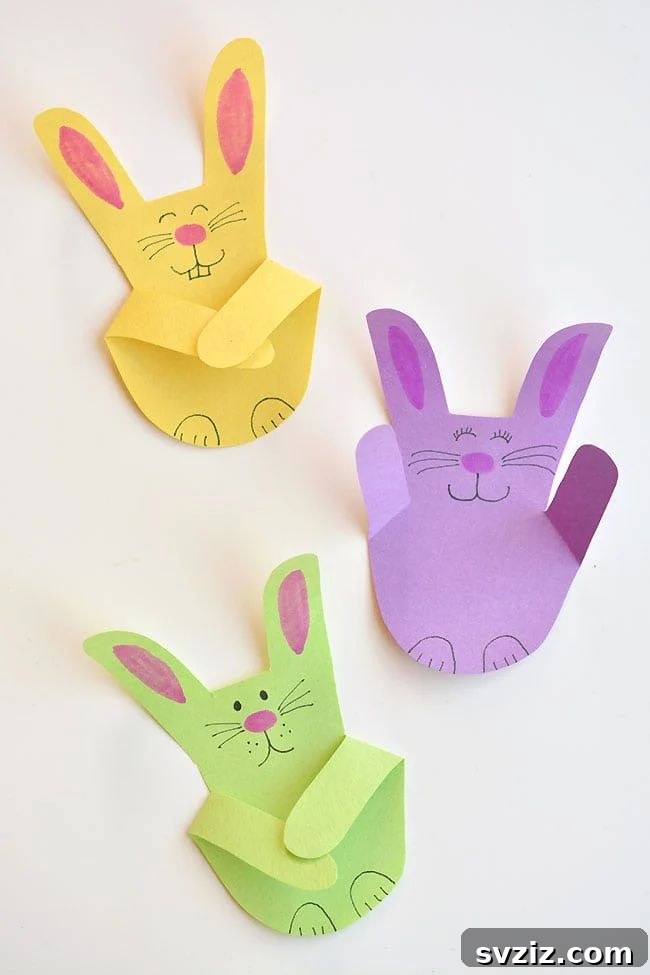 31 Effortless Kids Crafts for Hours of Fun 26 Sweet Handprint Bunnies craft, an easy and personalized Easter activity perfect for gift toppers or refrigerator display.
