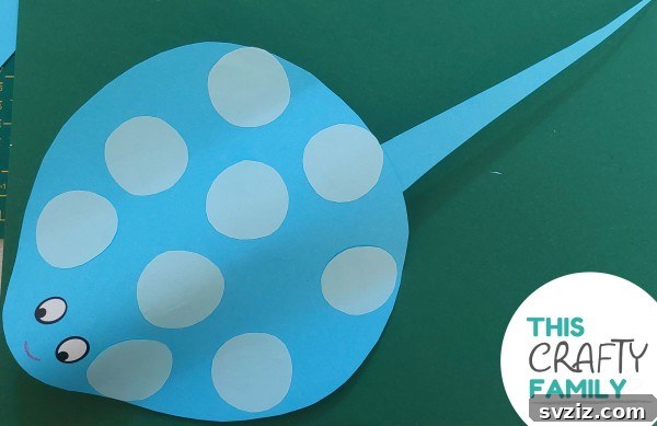 31 Effortless Kids Crafts for Hours of Fun 33 Charming Paper Stingray Craft using a recycled toilet paper roll, colored paper, markers, and googly eyes.