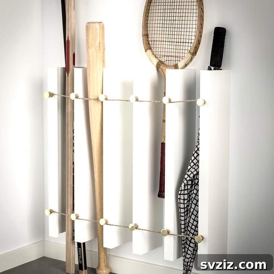 Sporting Equipment Wall Storage using IKEA picture rails and hooks for organized sports gear.
