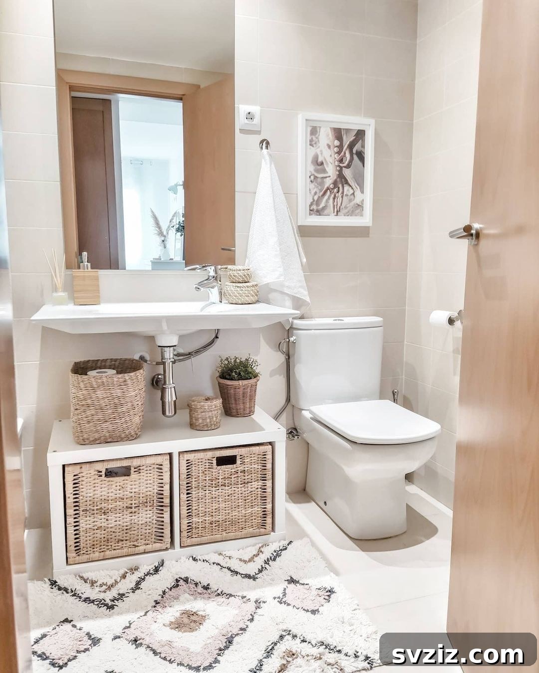 Under Sink Bathroom Hack utilizing IKEA Kallax cubes and woven baskets for organized storage.