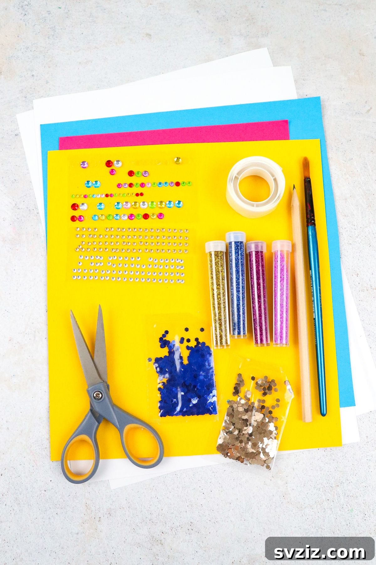 Materials laid out for making pretty butterfly suncatchers