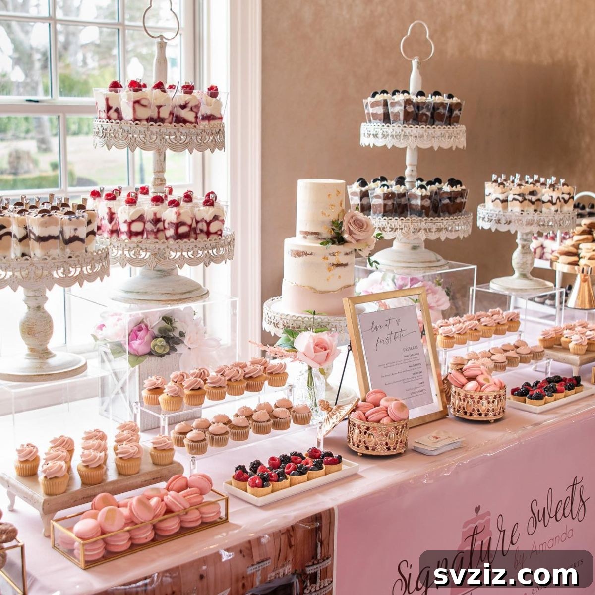 Exquisite Wedding Dessert Spreads 14 A enchanting 'Pink Dream Signature Sweets' dessert table, showcasing a variety of pink-toned treats like cupcakes, donuts, and macarons.