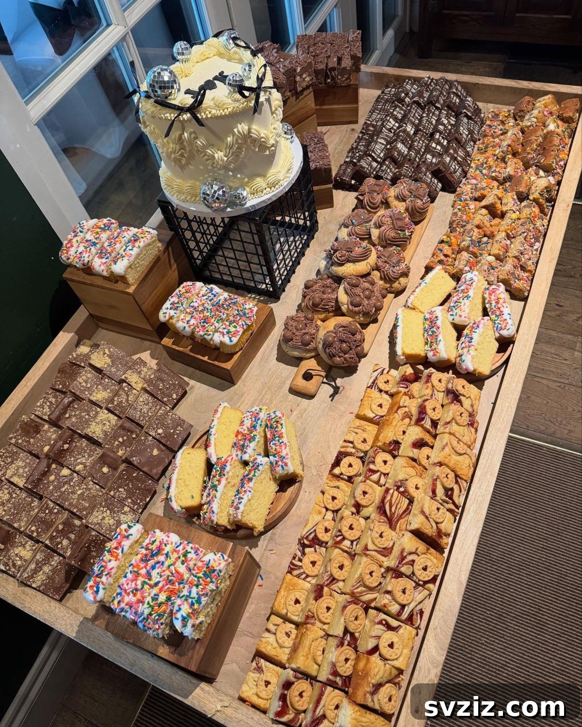 Exquisite Wedding Dessert Spreads 21 A lavish 'Dream Dessert Table' laden with heart-shaped cakes, cookies, brownies, and rocky road, creatively displayed on wooden platters.