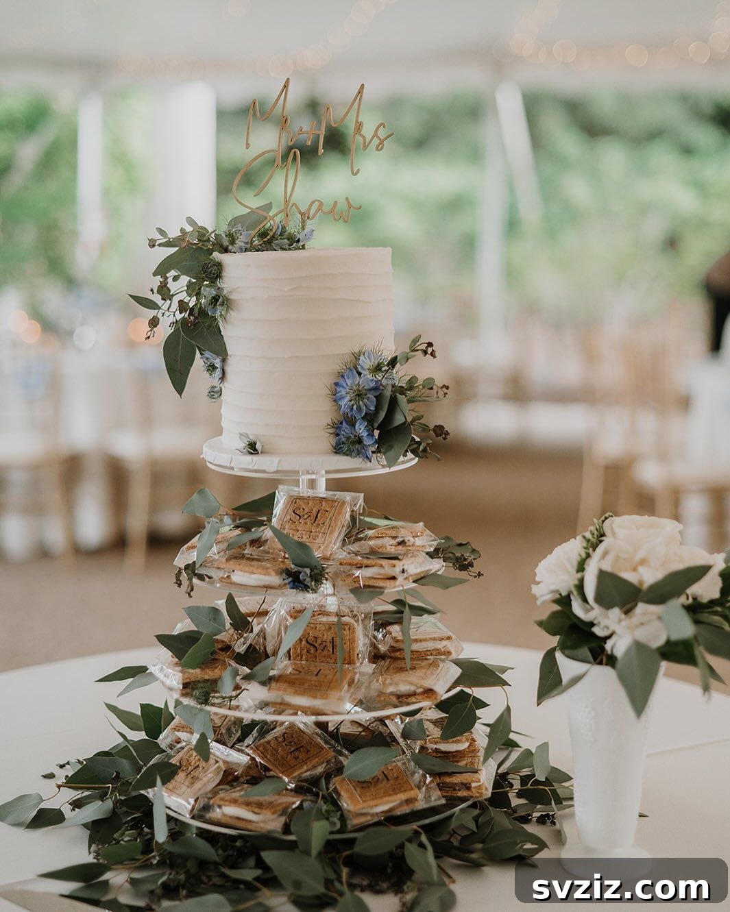 Exquisite Wedding Dessert Spreads 23 A delightful pairing of a wedding cake with a s'mores ice cream tower, creating a rich, creamy, and decadent dessert experience for guests.