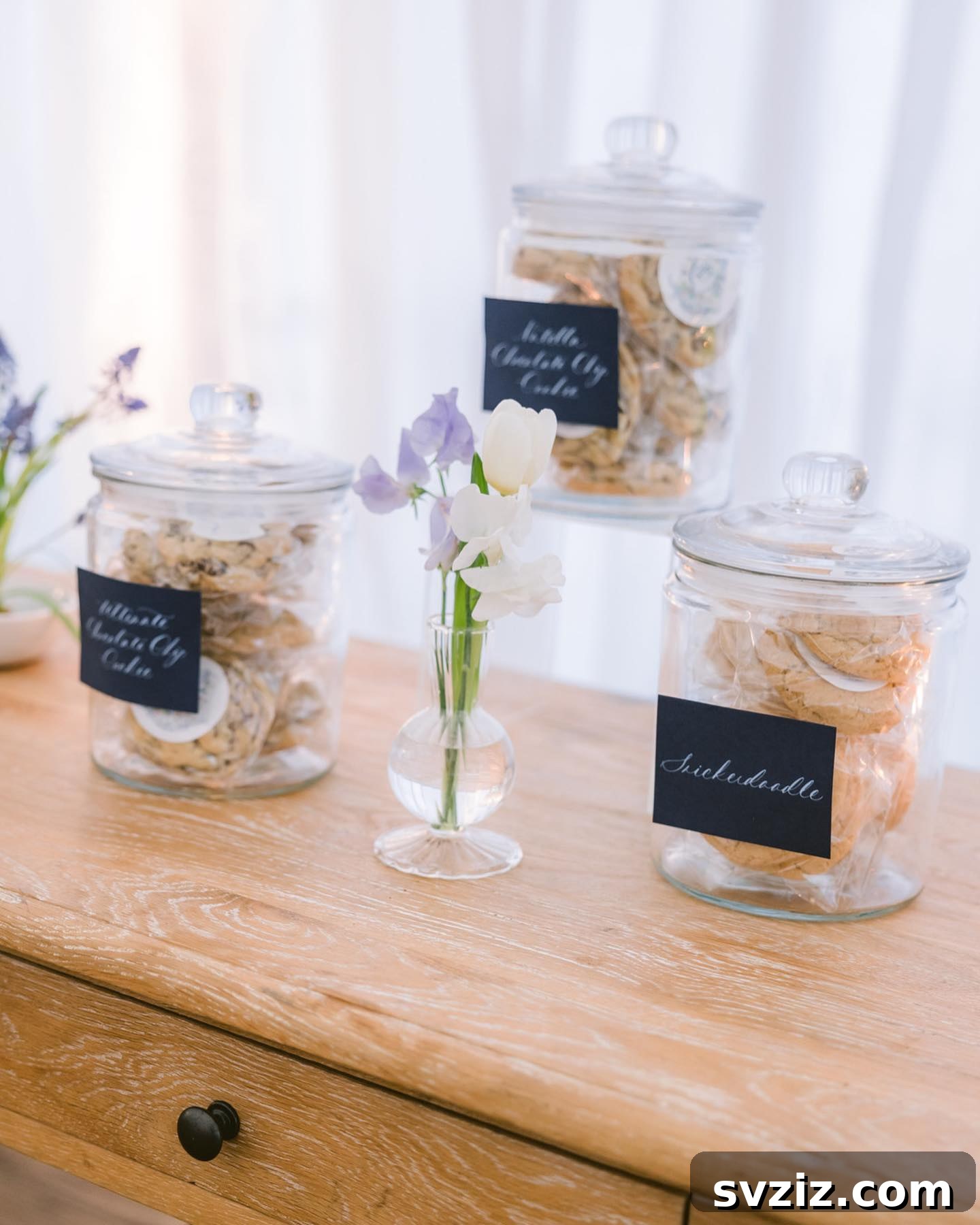 Exquisite Wedding Dessert Spreads 25 An adorable vintage cookie bar featuring various cookies in charming glass jars, evoking a nostalgic and old-world charm.