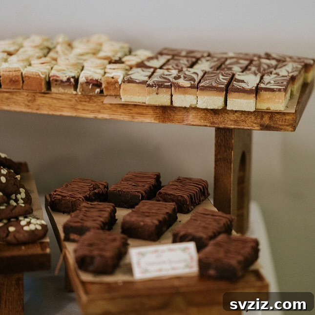 Exquisite Wedding Dessert Spreads 6 A rustic and inviting dessert table featuring an abundance of decadent brownies, displayed on warm wooden stands.