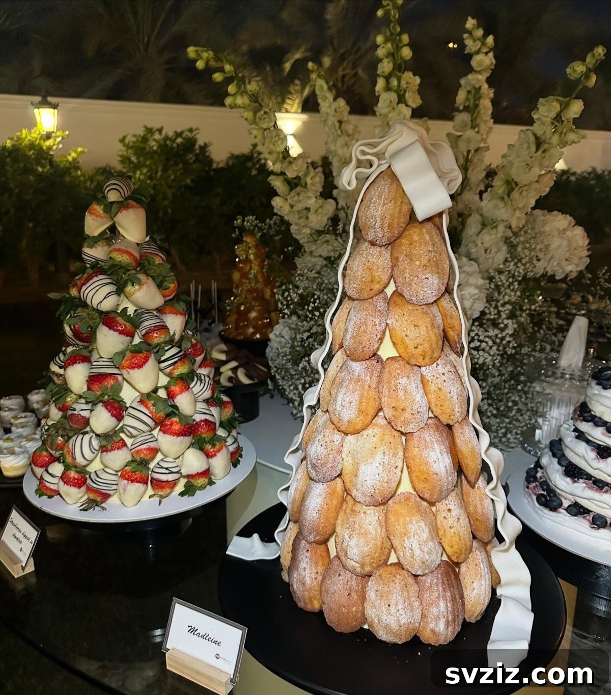 Exquisite Wedding Dessert Spreads 7 An exquisite wedding dessert table featuring a variety of tempting pastry towers, including a Madeleine tower, offering an elegant and irresistible display.