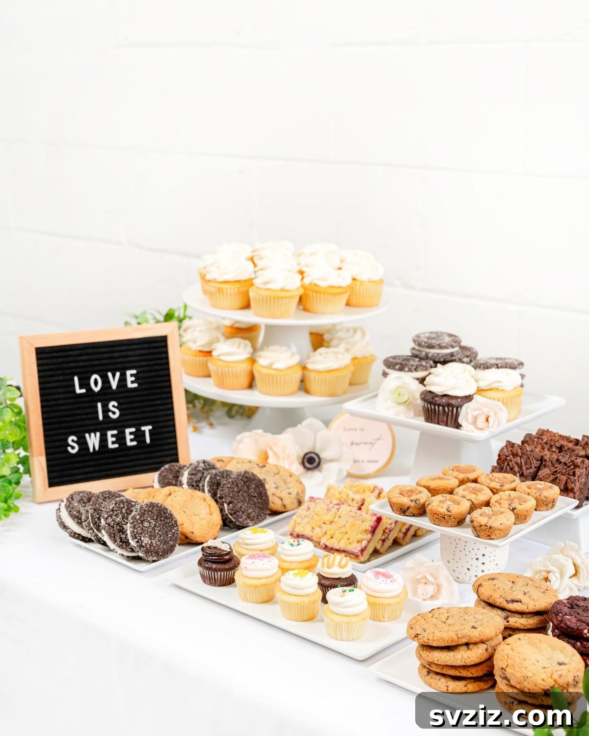 Exquisite Wedding Dessert Spreads 9 A charming and sentimental 'Love Is Sweet' dessert table featuring cupcakes and chocolate chip cookies, ideal for a relaxed and budget-friendly wedding.