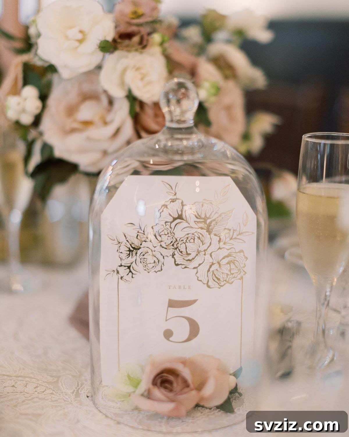 Elegant Bouquets and Glass Cloches with Table Numbers