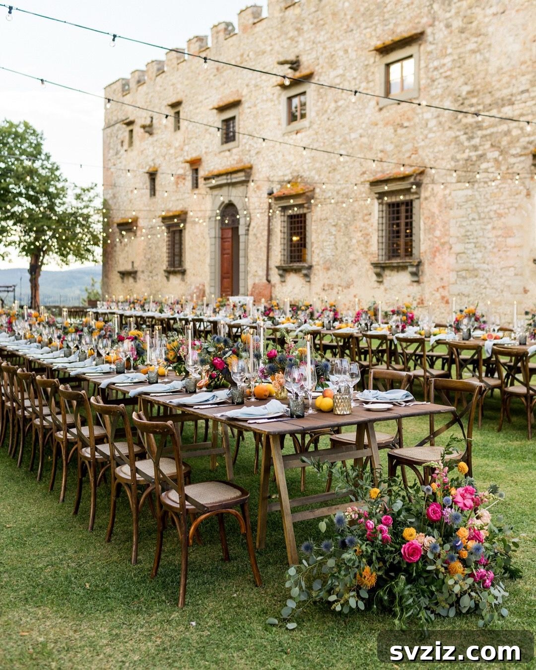 Charming Rustic Long Table Wedding Inspiration 16 Tuscan Fairy Tale Long Table Wedding Decor with Fresh Fruits, Colorful Flowers and Castello di Meleto Backdrop