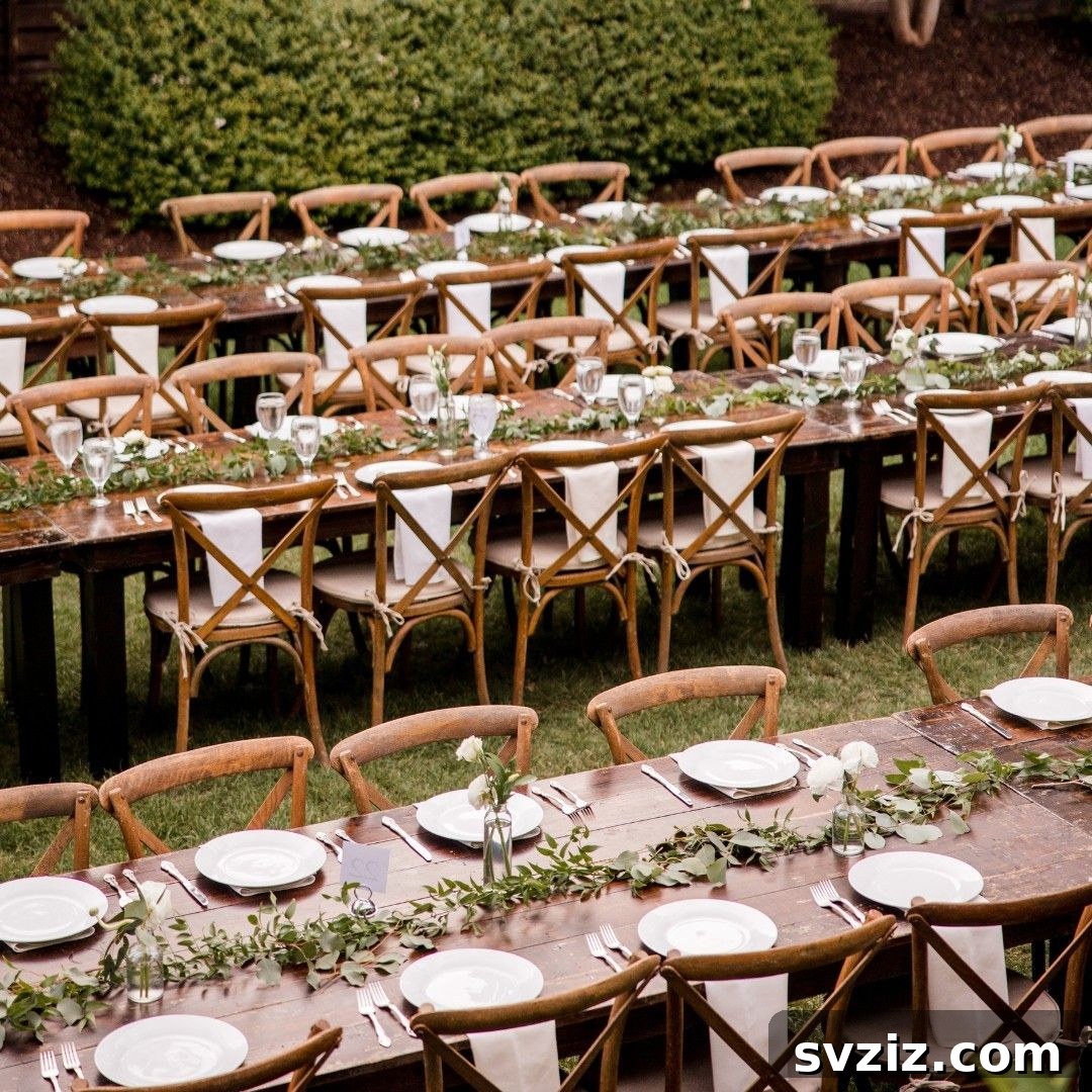 Charming Rustic Long Table Wedding Inspiration 17 Rustic Wooden Long Tables with Greenery and Cross-Back Chairs on a Grassy Lawn